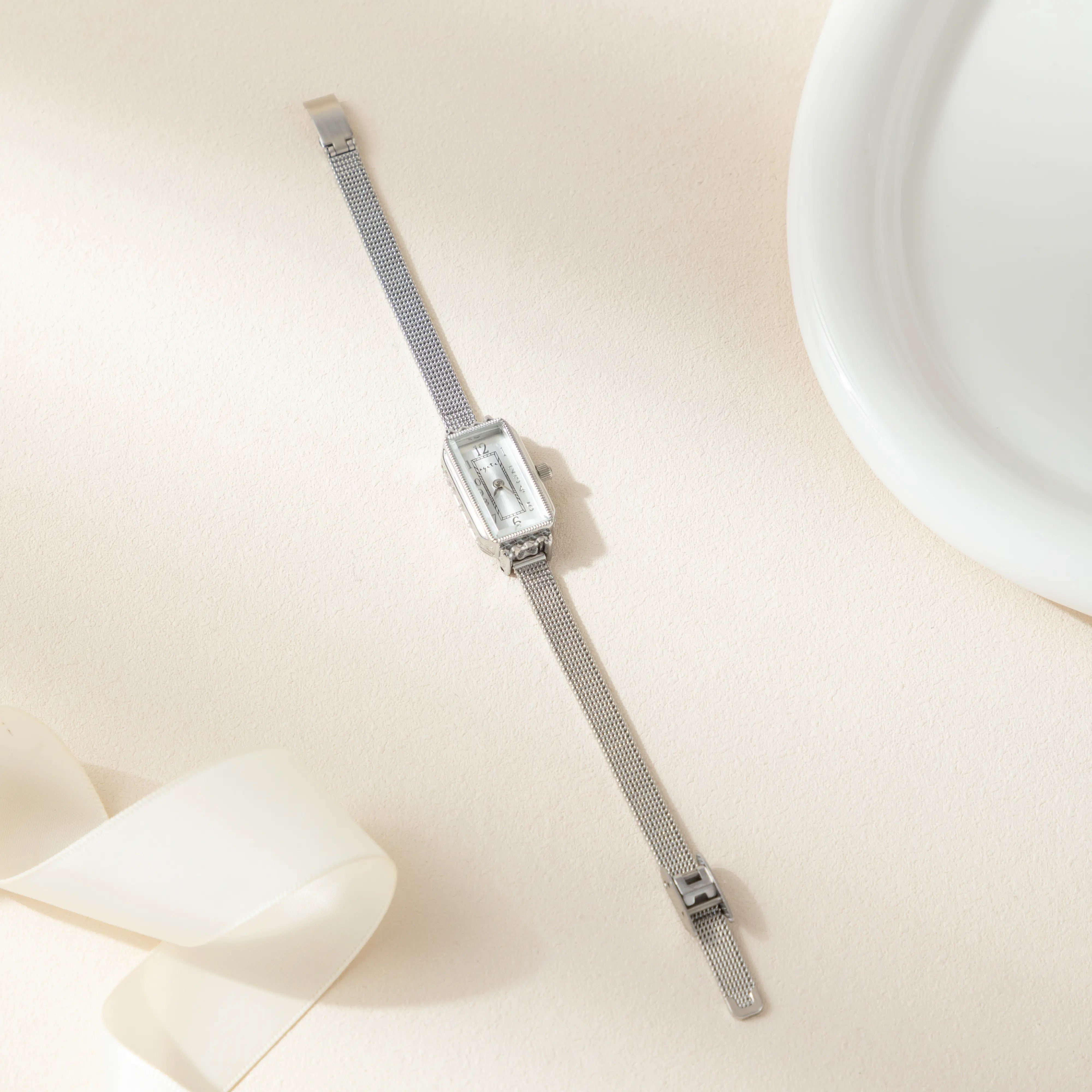 テレサ – 長方形のディスクを持つゴールドル。