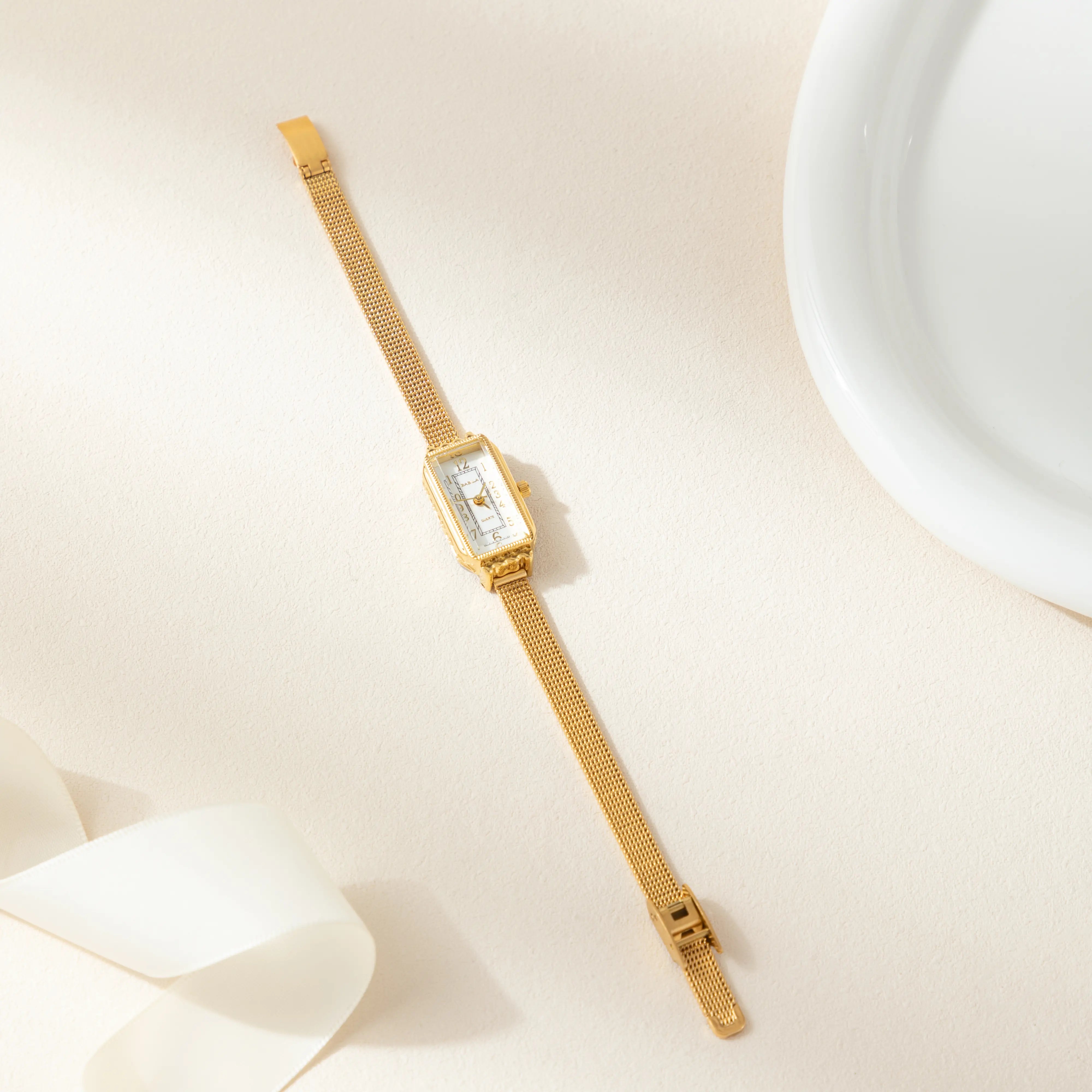 テレサ – 長方形のディスクを持つゴールドル。